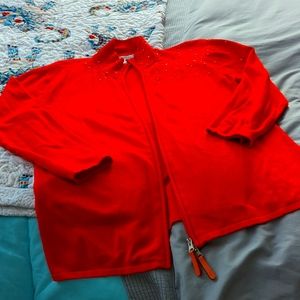 Bright orange embellished zip up sweater/jacket.